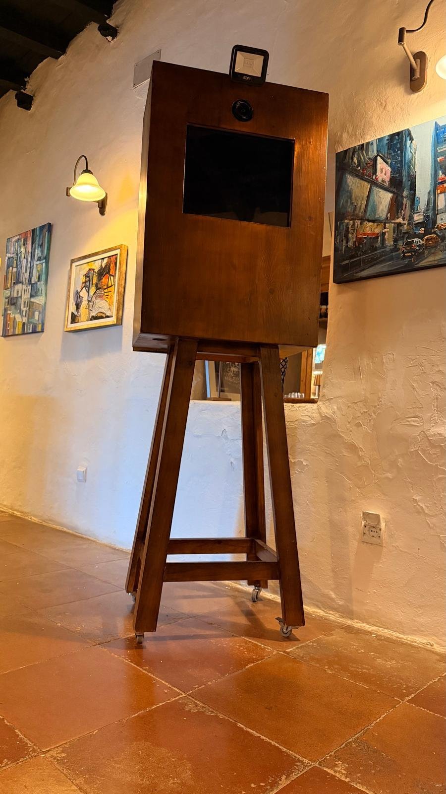 Front view of the retro photo booth wooden cabinet at a Casa Colonial Ibiza wedding