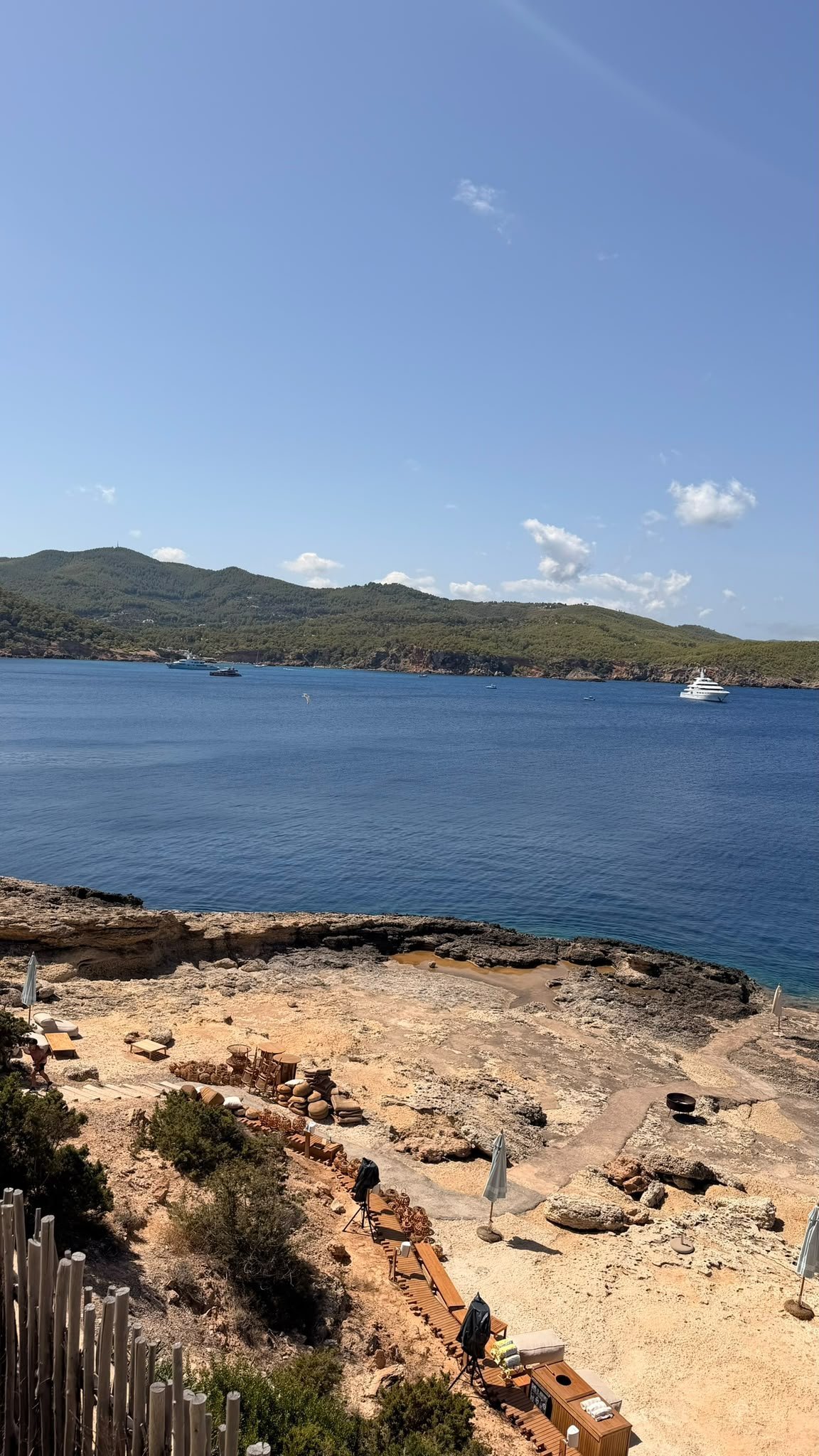 Private beach cove with wooden decking at Six Senses Ibiza, Xarraca Bay